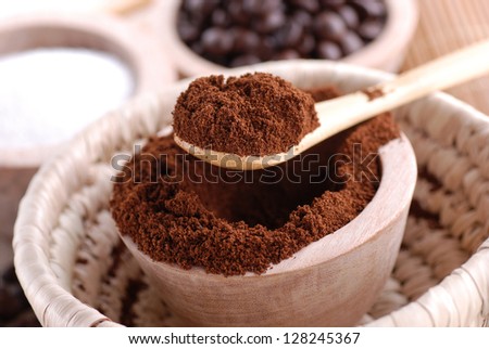 ground coffee in wooden bowl
