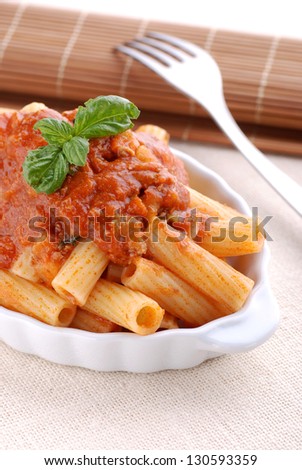 pasta with meat sauce in white bowl