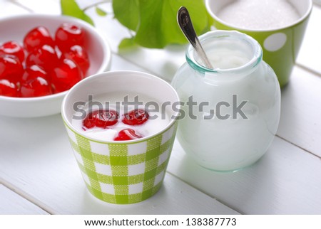 low-fat yogurt with cherries on the table