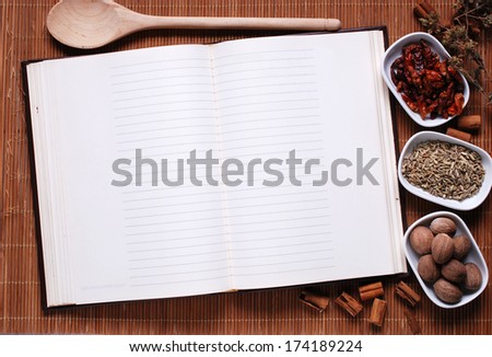 recipe book opened with blank pages on the table