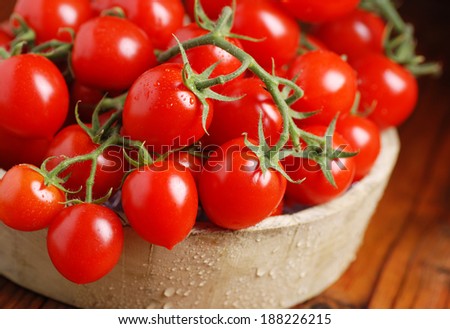cherry tomatoes in a wooden box on the table