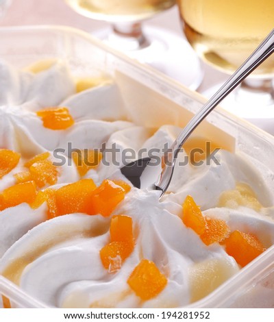 yogurt ice cream with pieces of peach