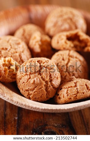 amaretti, traditional Italian cookies in the wooden bowl