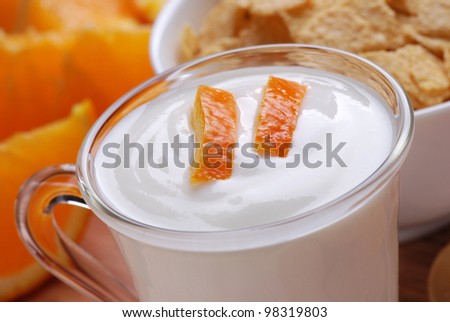 orange-flavored yogurt with fruit pieces in the glass