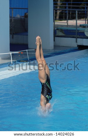 Competitions on jumps in water. A beautiful jump of the harmonous girl