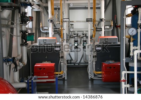 Interior of modern gas boiler-house with two boilers