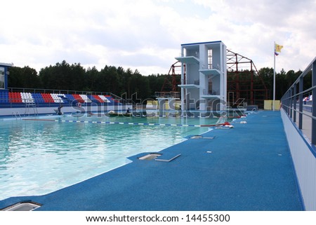 Springboard for jumps in water in sports pool