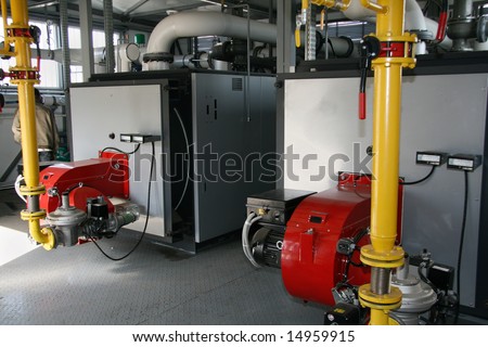 Interior of independent modern gas boiler-house with two steel boilers