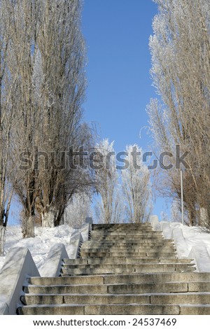Steps of a deserted stone ladder in winter park