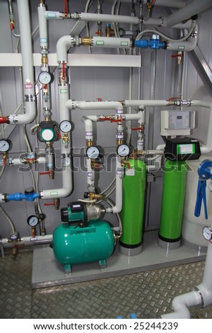 Pumps, pipelines and devices in an interior of modern boiler-house