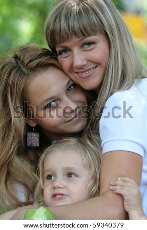 Portrait of happy mum and two daughters