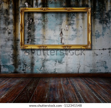 Picture frame put on wall in grunge room.