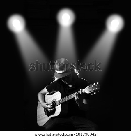 Man playing guitar. Black and white photo