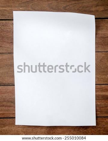 White paper A4 size on wood.