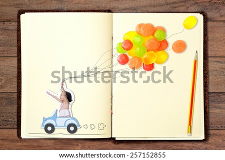 Girl driving a car and candy balloon. Design with paper craft put on book.