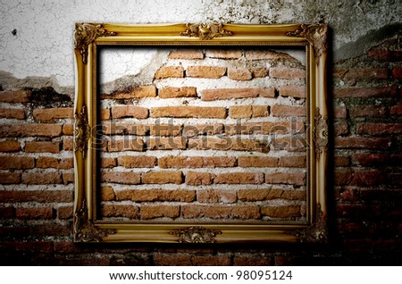 Old picture frame on brick wall to put your own pictures in.