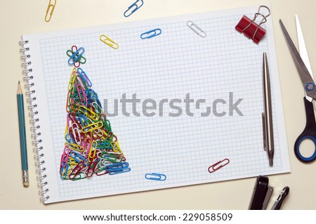Christmas greeting card made of colorful clips and other office supplies