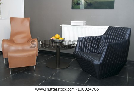 two chairs for relaxing in the living room beside the table