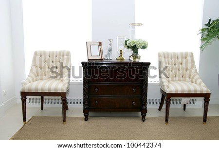 two chairs for relaxing in the living room beside the table