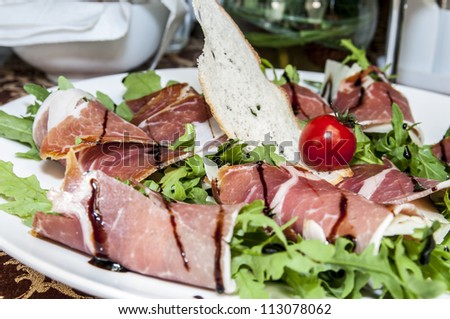 meat rolls with meat and greens on a table in a restaurant