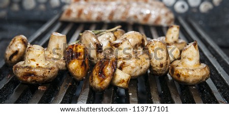 Cooking mushrooms on the grill in the restaurant