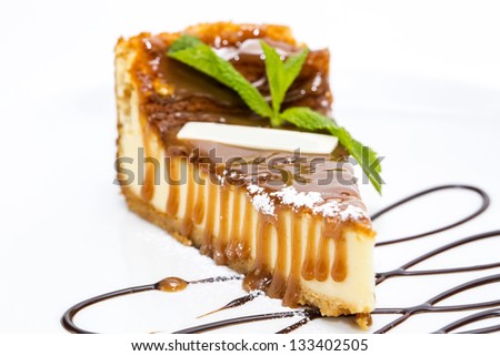 a piece of cheese cake on a table in a restaurant