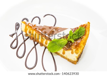 piece of cheese cake decorated with mint leaves