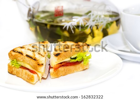 sandwich with tea on a white background in restaurant