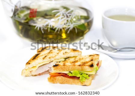 sandwich with tea on a white background in restaurant
