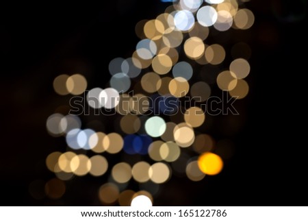 colored circles on a dark background bokeh