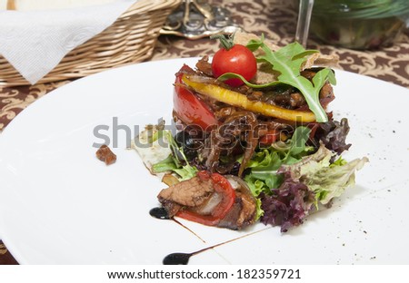 salad with vegetables and pine seeds on a white background