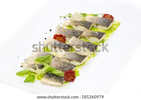 baked black cod fish on a white background in the restaurant