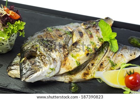 Baked fillet of bream fish cooked on the grill in the restaurant
