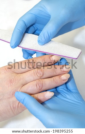 woman doing manicure beauty salon