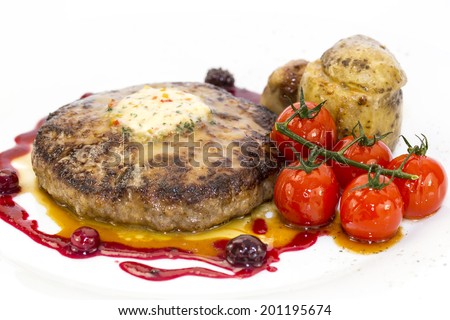 steak with tomato sauce and mushrooms on a white background in the restaurant