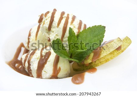 ice cream with caramel sauce and mint on a white background