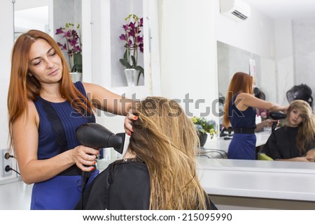 woman in a beauty salon doing hair