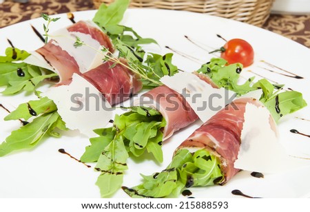meat rolls with meat and greens on a table in a restaurant