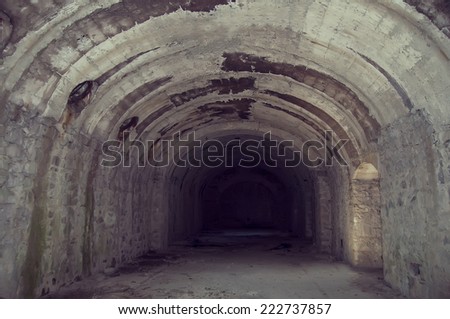 old tunnel of stone and concrete underground