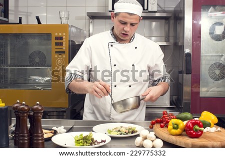chef preparing food in the kitchen at the restaurant