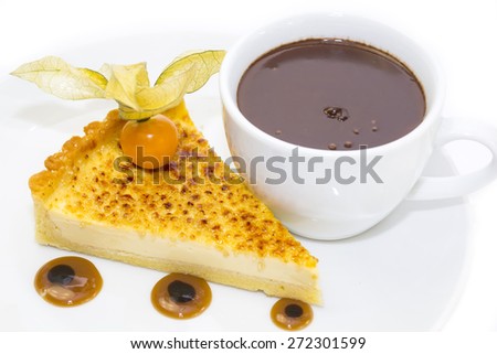 piece of cake with passion fruit and a cup of hot chocolate