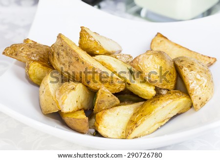 fried potatoes on a plate in a restaurant