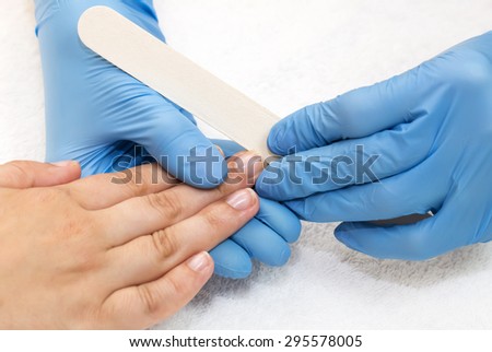 woman doing manicure beauty salon varnish wellness
