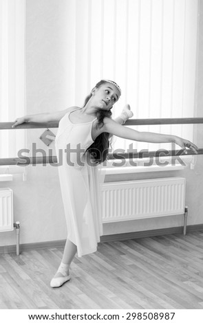 a little girl dressed as a ballerina in ballet