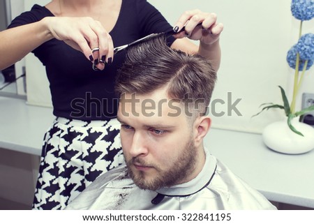 The young man at the hairdresser salon hairstyle make model