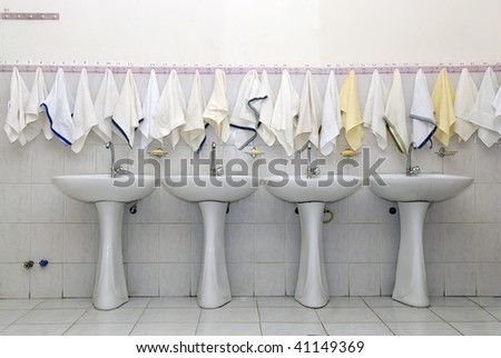 Washstands and towels in a boarding school bathroom