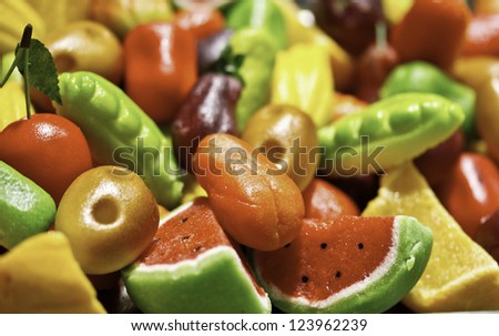 Colorful marzipan sweets with fruits shapes made of almond and suga