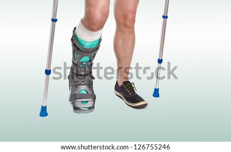 Man with a broken leg with Crutches and Orthotic