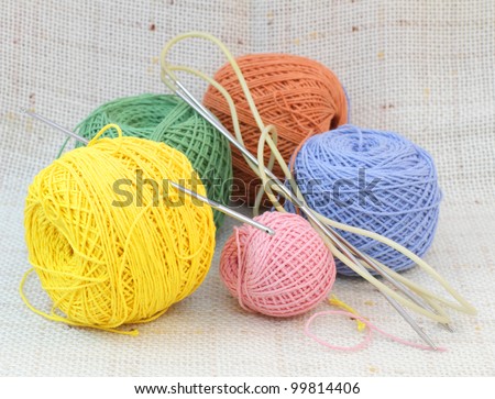 Knitting coloured balls and knitting needles and hook