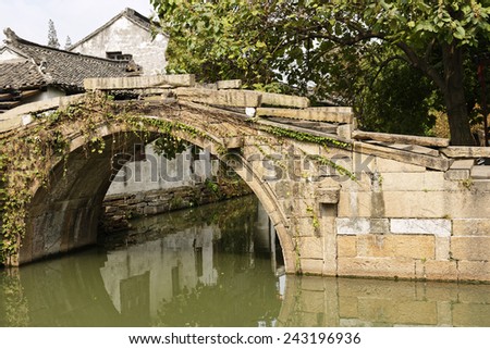 Ancient bridge over a canal in the water township of Zhouzhuang near Shanghai, China